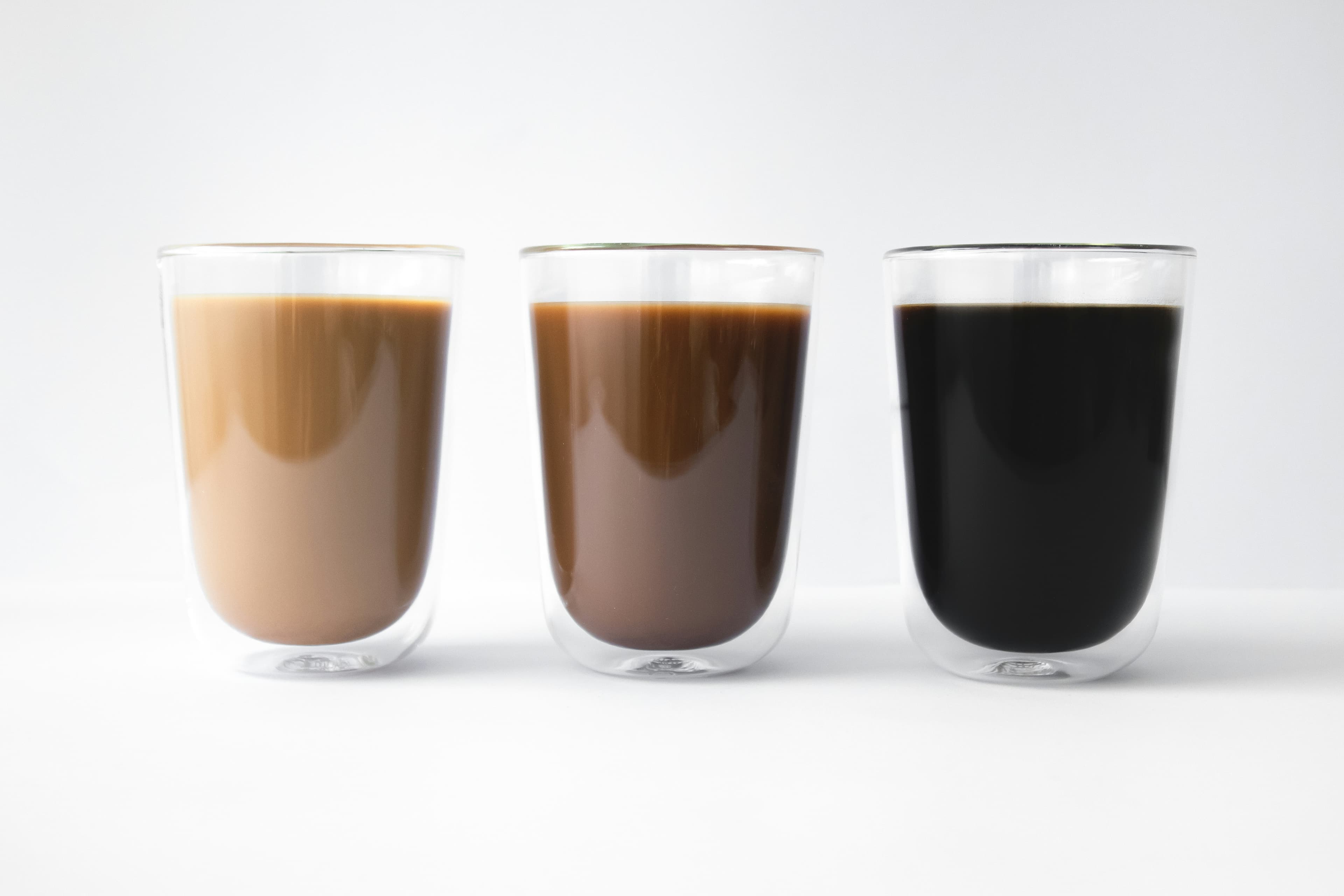 Three coffees prepared side by side